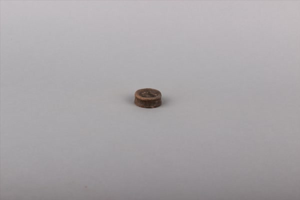 商黑褐陶纺轮